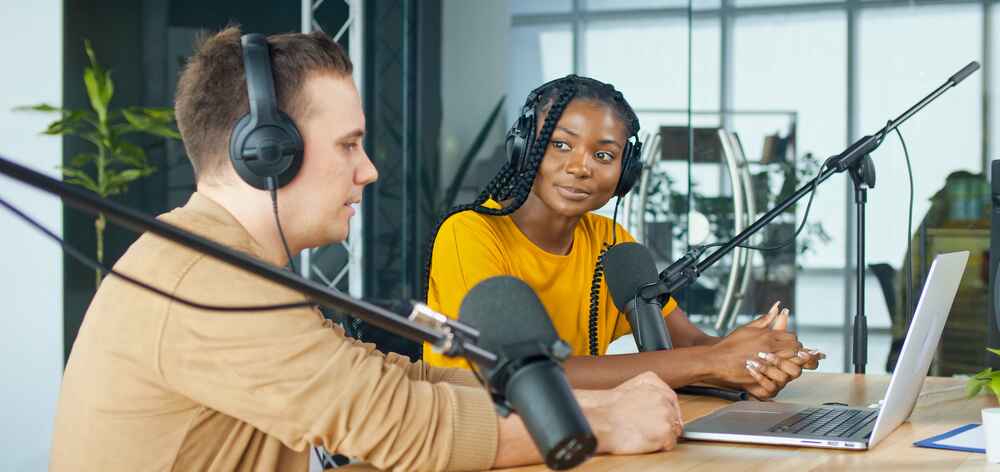 A Male Presenter Communicates with a Guestd uring a Radio Broadcast