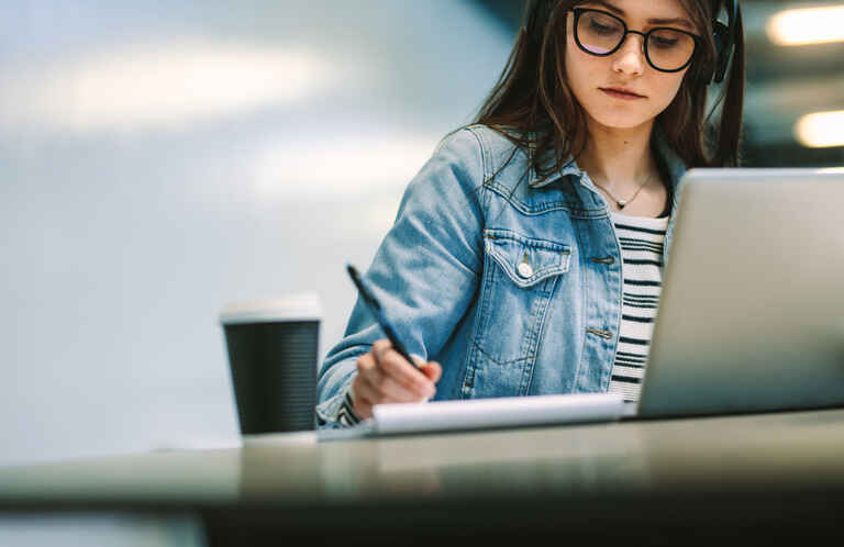 University student studying at library