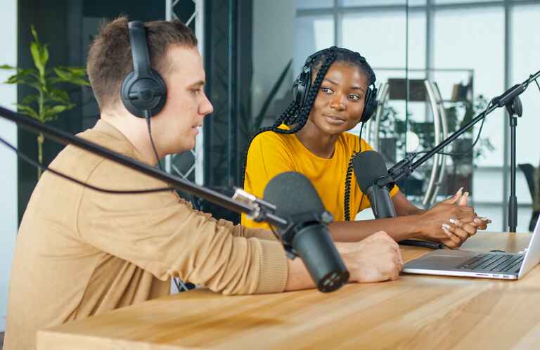 A Male Presenter Communicates with a Guestd uring a Radio Broadcast