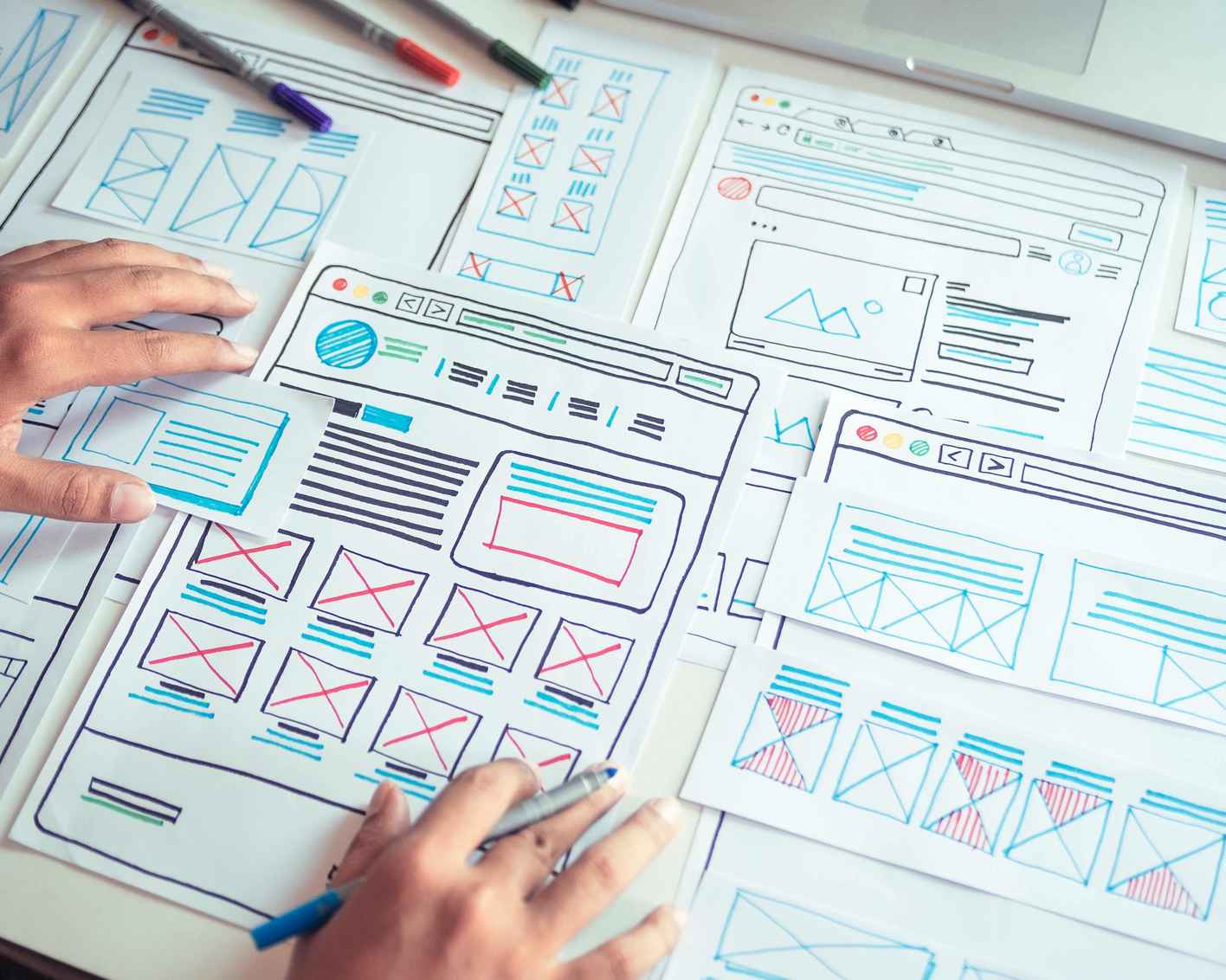 Web developer drawing sketches of images