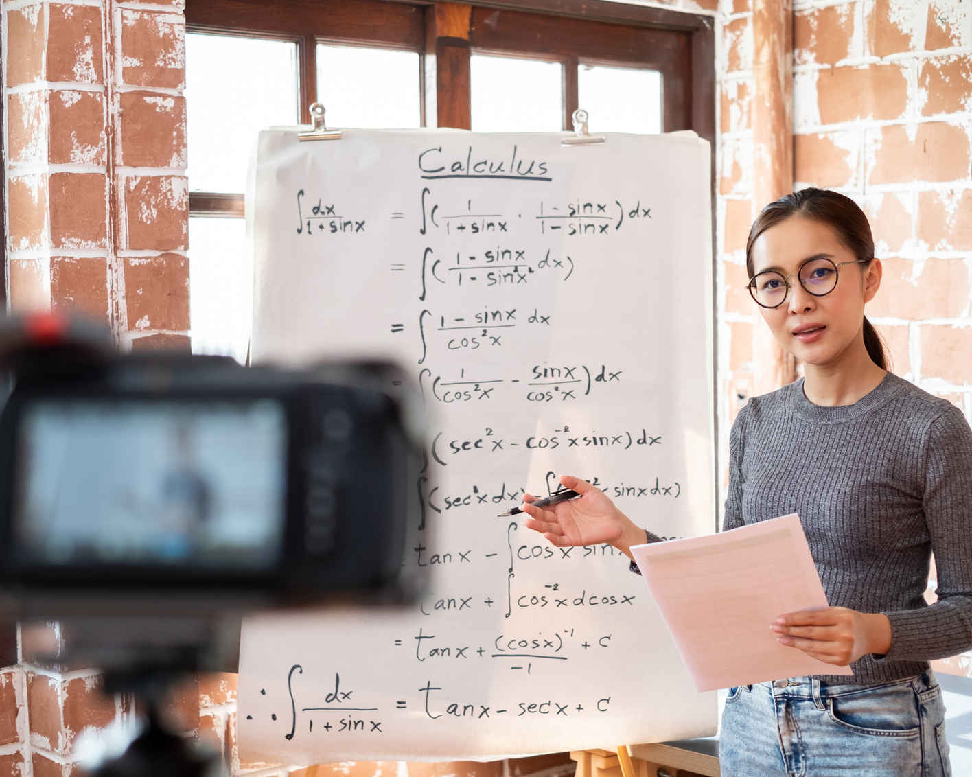 Asian woman teacher teaching lesson online learning via internet at home