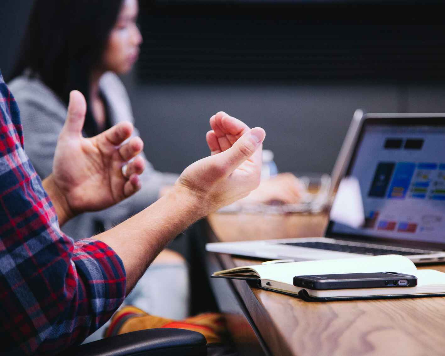 Close up photo a man and women working on laptop computers