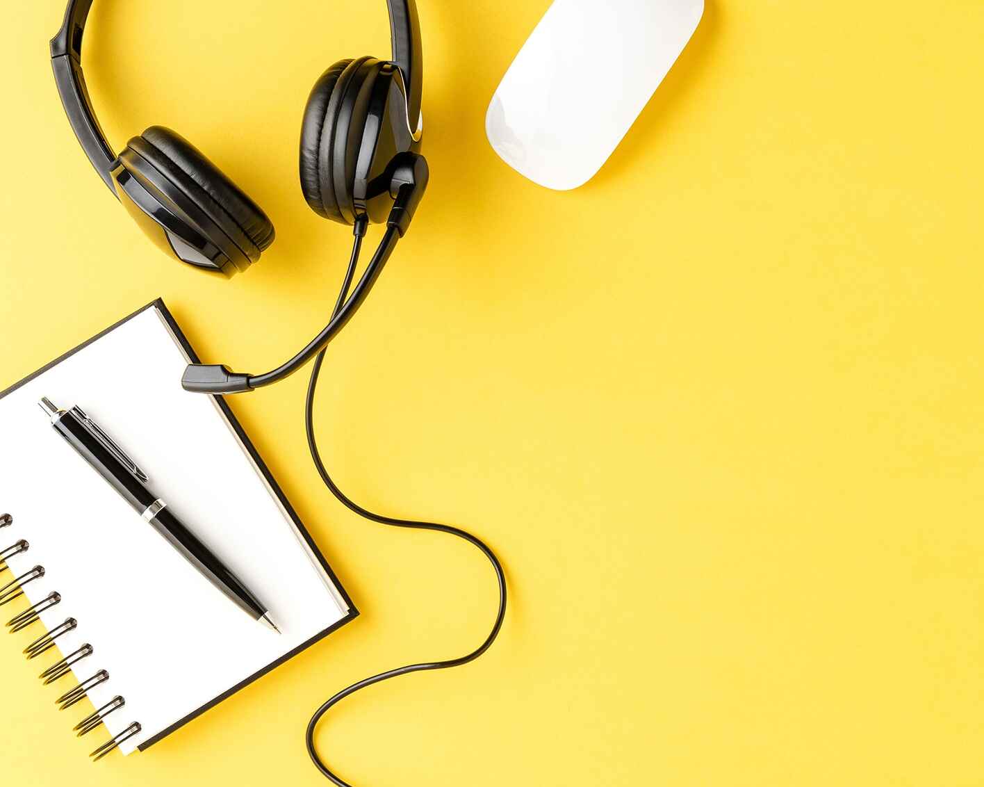 Headset, keyboard, mouse, pen and notepad