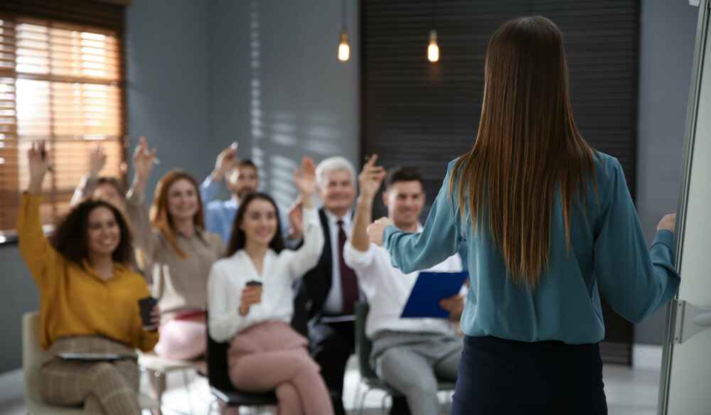 An instructor facilitating discussion in a classroom