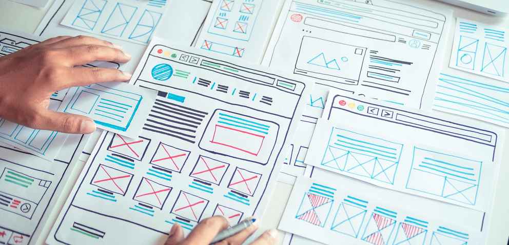 Web developer drawing sketches of images