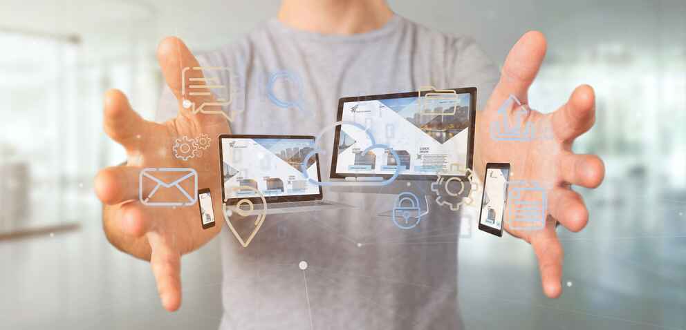 Businessman holding a Devices connected to a cloud multimedia network 3d rendering