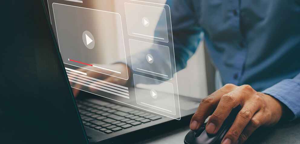 Businessman hands using laptop for streaming online, watching video on internet.